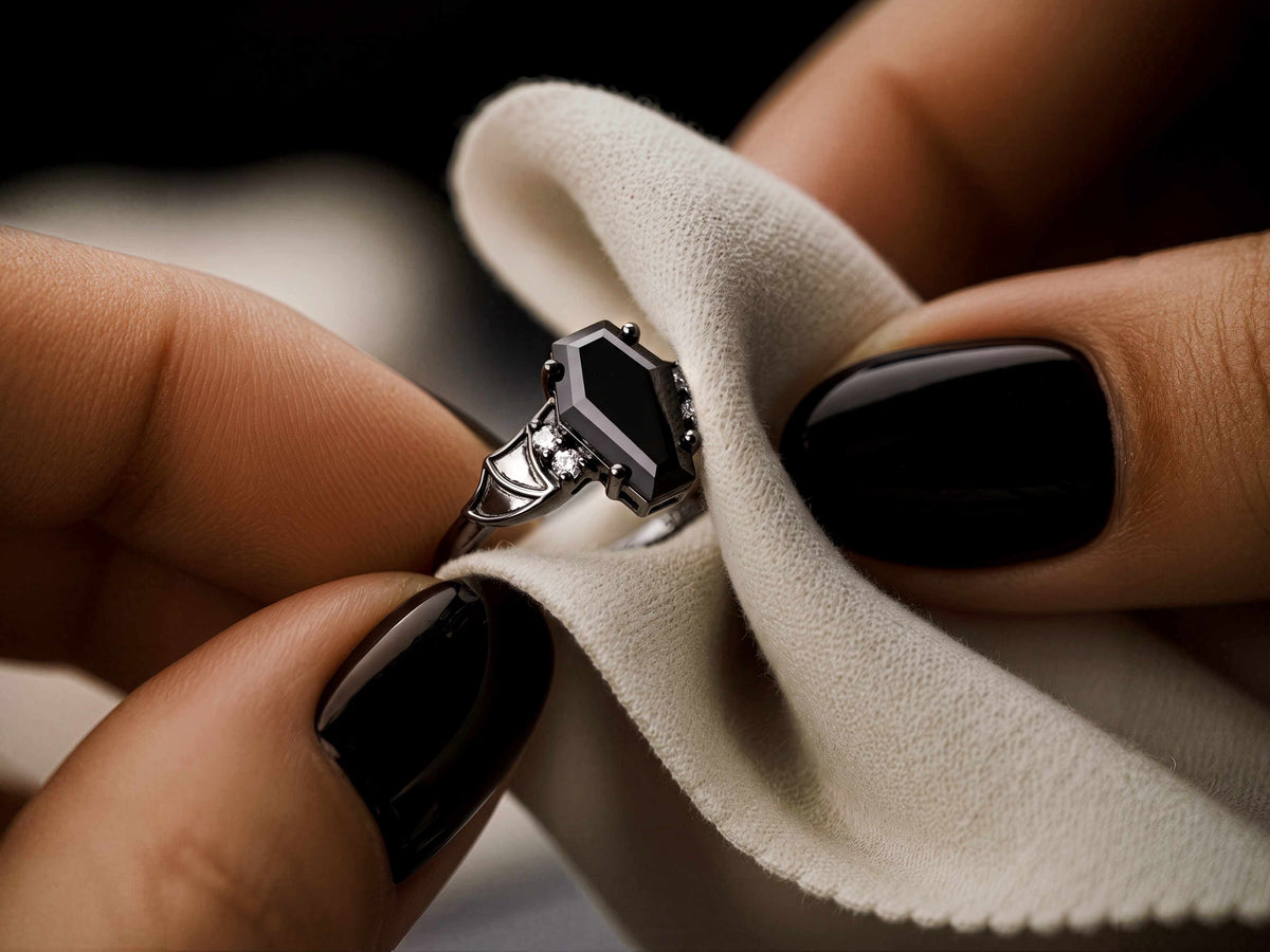 Ring being wiped gently with a soft jewelry cloth