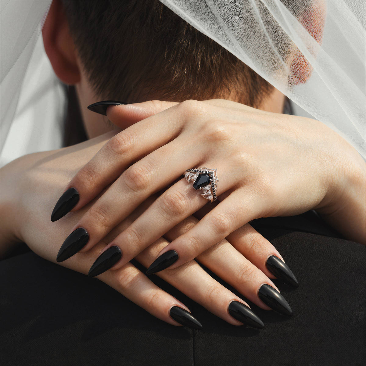 Black moissanite coffin ring with coordinating gothic wedding bands